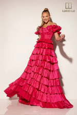 This dress features an off-the-shoulder neckline with ruffle detailing, a lace-up back and a skirt with tiered layers creating volume in this taffeta fabric. This gown is playful and could be perfect for your next prom or formal event.

LU 1431