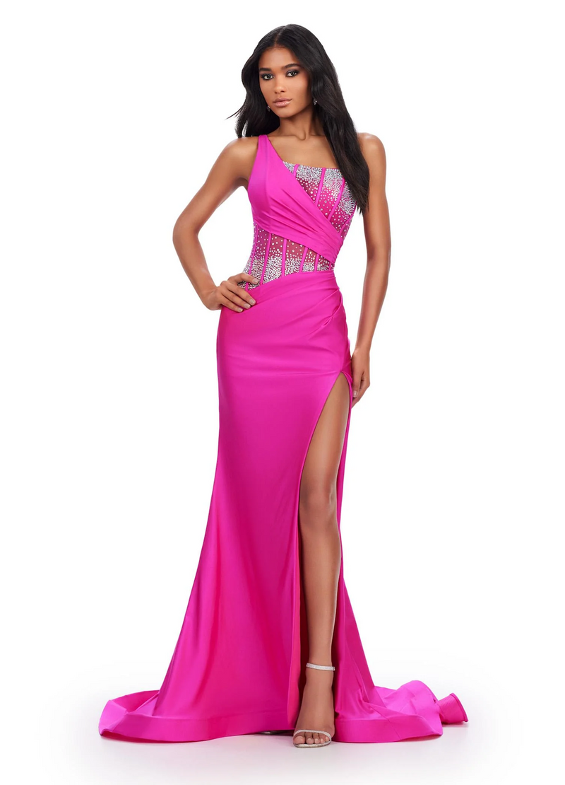 This dress features a sheer bodice with corset boning and a one-shoulder neckline detailed with crystal embroidery. The fitted silhouette has a side slit and long train and jersey fabric. This dress is vibrant and could be perfect for your next prom, pageant or formal event!

Ashley Lauren 11617