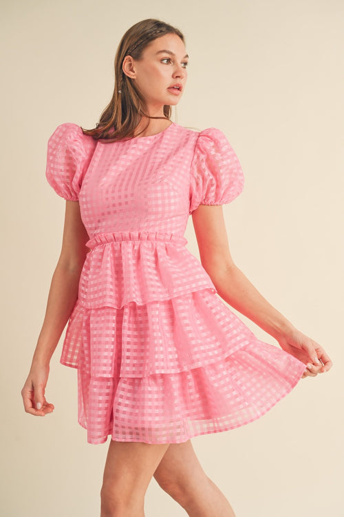 This modest cocktail dress features puff sleeves, plaid organza jacquard fabric, a round neckline and a ruffle waist with a tiered layered skirt. Style this dress to make it your own at your next homecoming or formal event!  MCI MDR2968