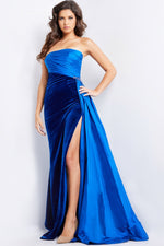 This couture gown features a strapless neckline with a ruched detailed bodice which gathers into a cluster of beaded jewels and flows into a side skirt design. The skirt is velvet fabric and fitted with a high-slit for extra drama. This gown is truly unique which may be ideal for your next pageant or formal event.&nbsp;

Jovani 23947A