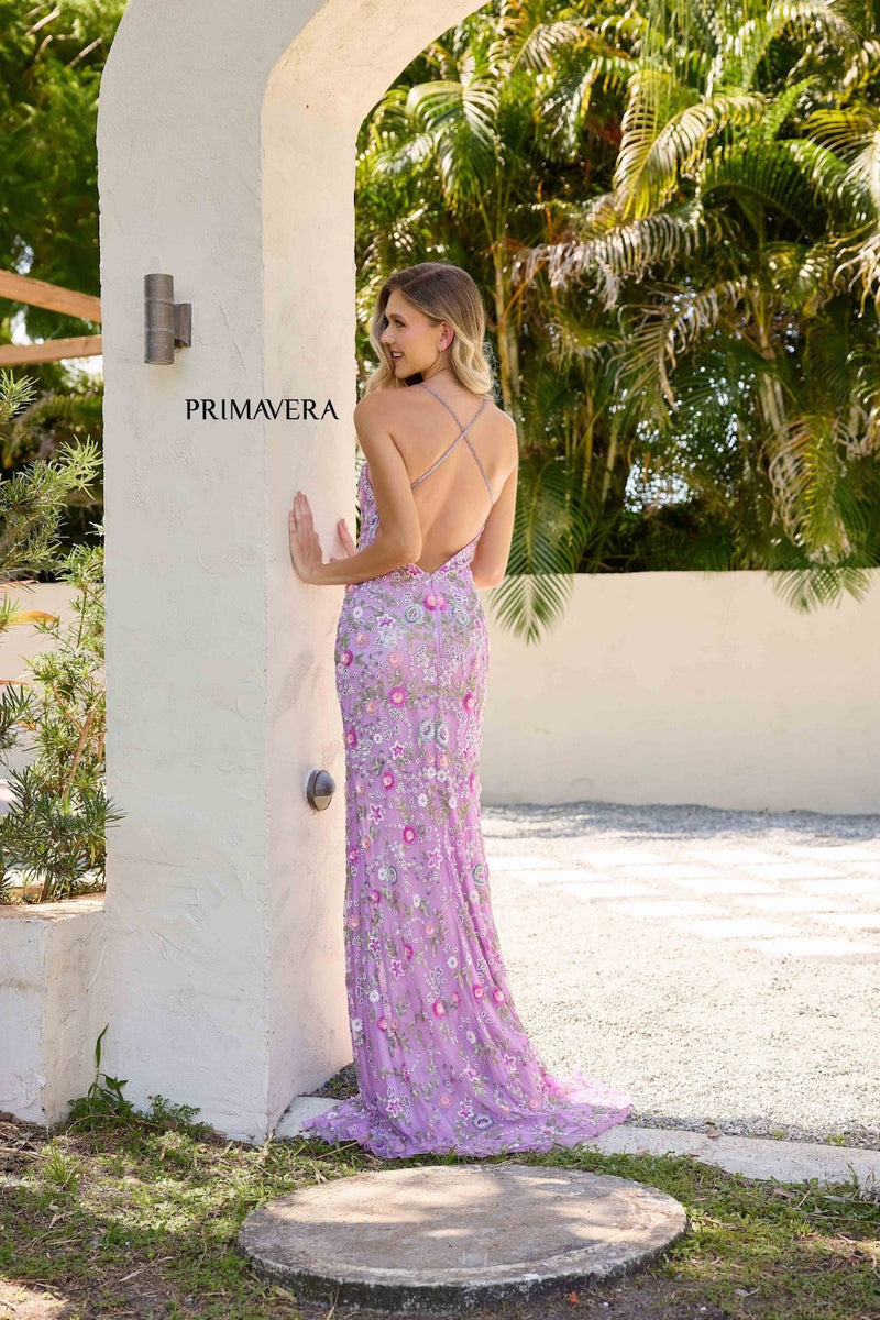 This fitted gown features floral sequin designs and a halter neckline with a criss-cross back. Pair this unique dress with simple heels to complete the look.


PV 3073