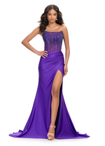 This Ashley Lauren gown features a strapless neckline, jersey fabric, and a stunning hot pressed stoned corset top. Pair this dress with some sparkly heels for a fun and unique prom or pageant look.&nbsp;

Ashley Lauren 11690