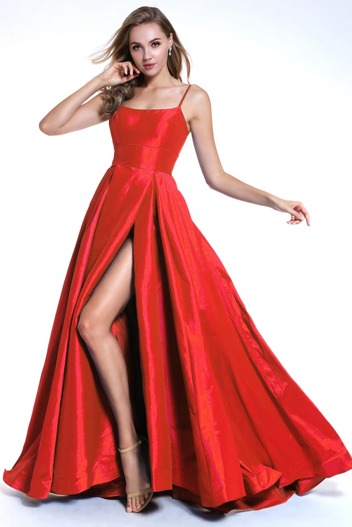 This simple long gown features a straight neckline with delicate straps and a high slit. The soft taffeta material of this dress makes it perfect to dance the night away in at prom.  ARY 35738