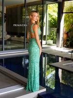 This dress features a v-neckline with side cut-outs that lead to an open back with a lace-up. The silhouette is fitted with a slit and fabric embellished with sequins in an intricate pattern. This dress is uniquely designed and could be ideal for your next prom or formal event.  PV 4175