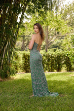 This dress features a strapless neckline with an illusion-plunging deep-V in the bodice. A lace-up back and a fully beaded gown create a fitted silhouette. This gown is unique and could be just the vibe for your next prom or formal event.

PV 4338