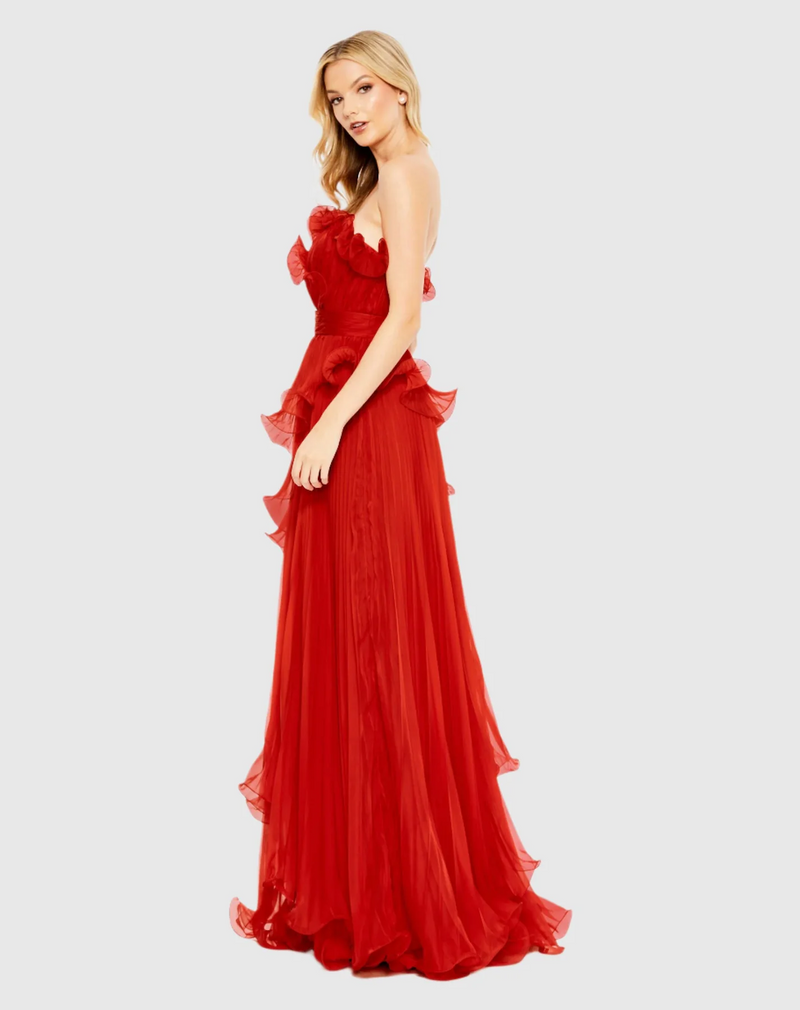 Designed in solid chiffon, this dress focuses on luxe texture—pleats and structured ruffles. The strapless neckline pairs perfectly with a faux waist sash and a Grecian-inspired asymmetrical, tiered skirt. Stun at your next prom or formal event in this stunning gown.

Mac Duggal 49537