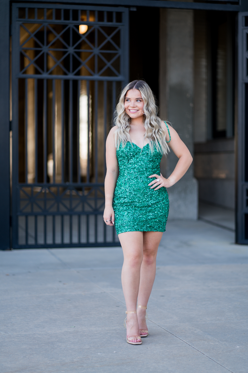 Glam up your next homecoming dance in Kendelyn! This glittery sequin dress features a lace-up back to show off just the right amount of your glittery self. Feel sparkly and shine radiantly at your next homecoming, sweethearts or formal event.  Ashley Lauren 4625