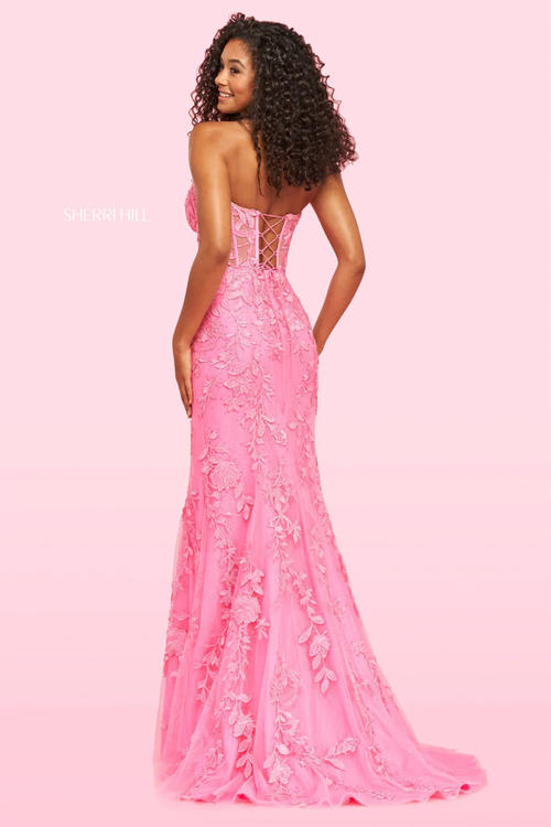 This stunning fitted Sherri Hill gown features a corset top with lace applique throughout the bodice. Pair this dress with simple earrings to complete your prom look.

SH 54227