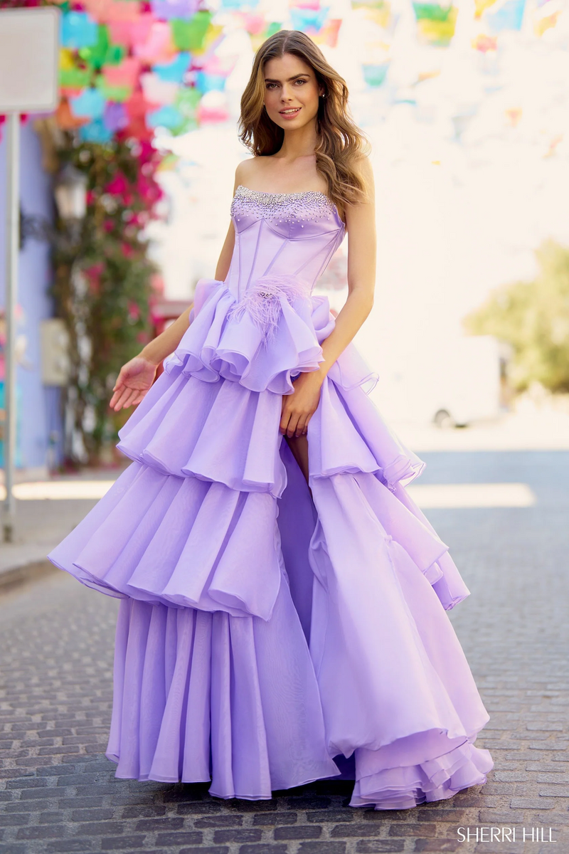 This dress features a strapless neckline with a satin corset with pearl embellishments, an organza ruffle skirt with a slit. This dress is elegant and could be ideal for your next prom or formal event.

Sherri Hill 55957