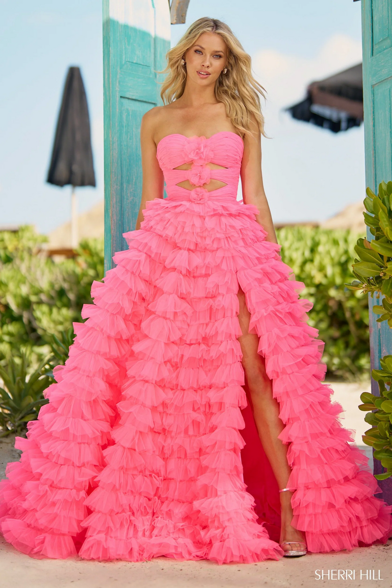 This dress features a strapless neckline, a bodice with keyholes, rosette embellishments, and a tulle ruffle skirt with a slit. This glamorous dress may be perfect for your next prom or formal event.

Sherri Hill 56067