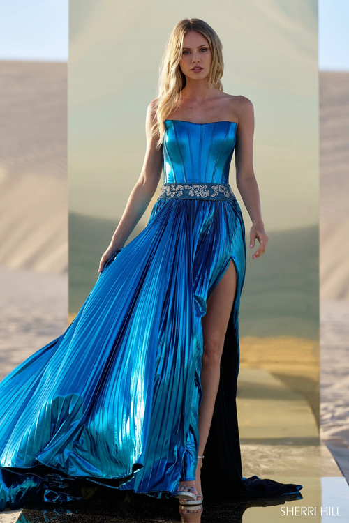 This dress features a metallic fabric with a strapless neckline with a beaded waistband and a pleated skirt with a slit. This dress is eye-catching and could be perfect for your next pageant or prom.

Sherri Hill 56522