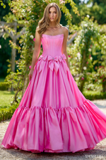 This dress features a strapless neckline with a drop-waist bodice with corset boning. Bow details with beaded embellishments are along the waistline all in a taffeta fabric. This dress is feminine and unique and could be ideal for your next prom or formal event.

Sherri Hill 56958