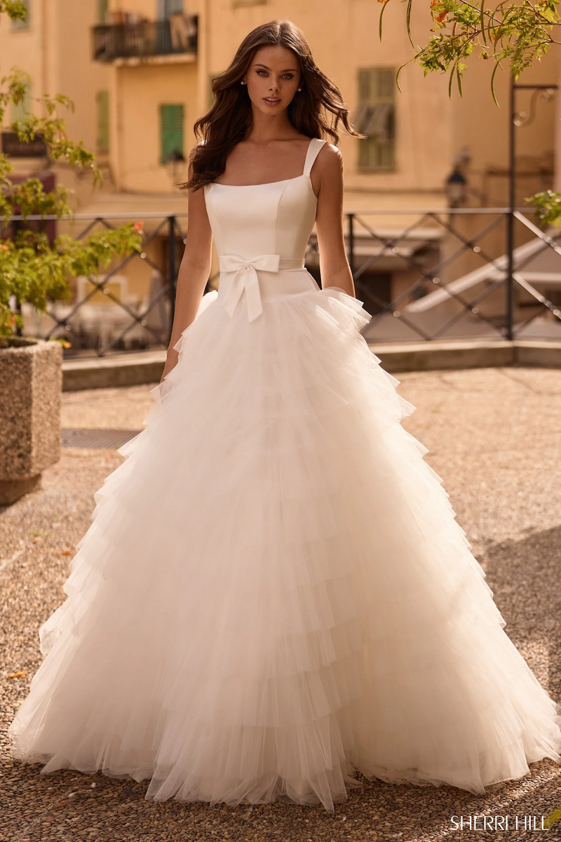 This dress features a satin bodice with a tulle ruffle skirt. The A-line silhouette is dramatic and could be ideal for your next prom or formal event.

Sherri Hill 57117