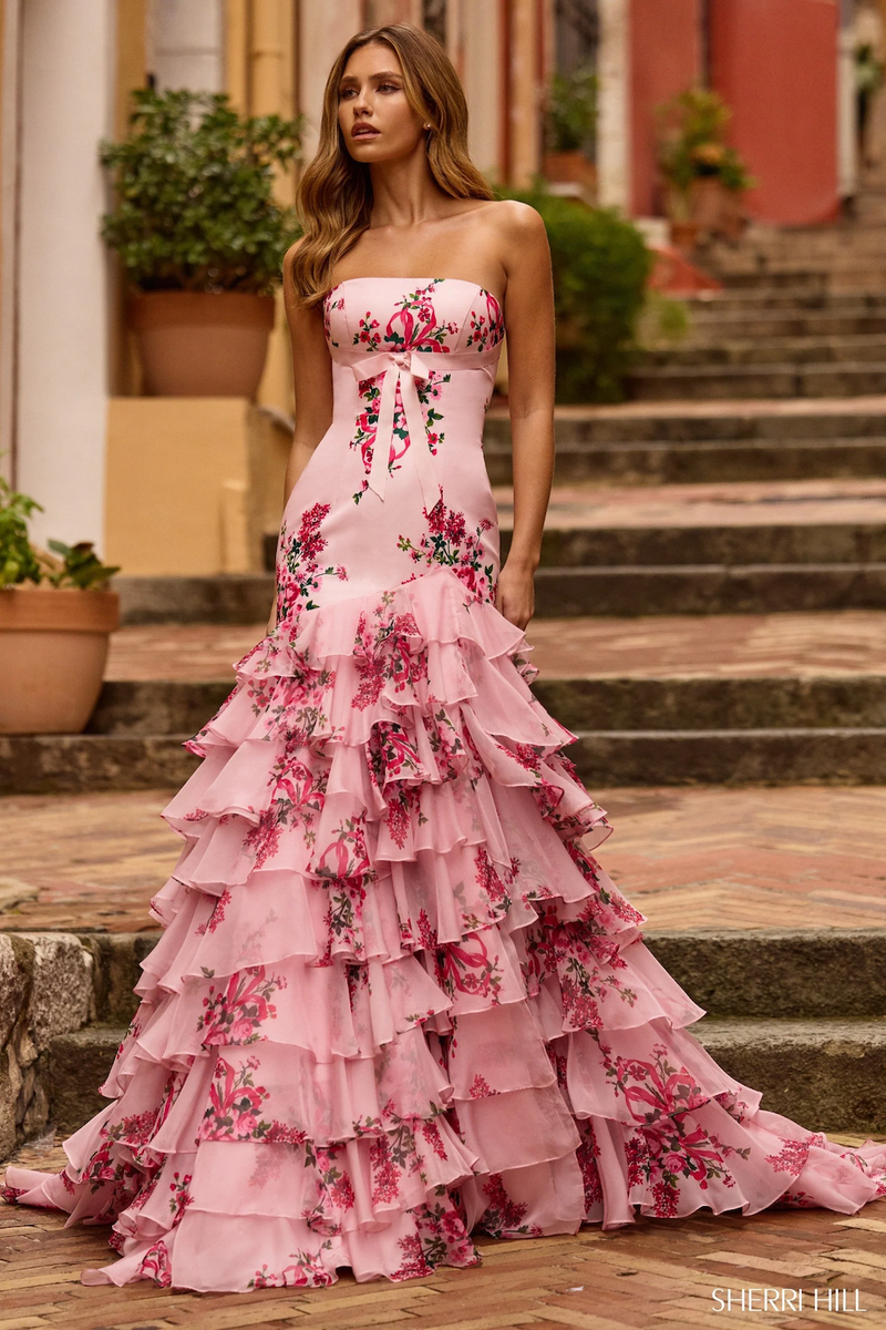 This dress features a strapless neckline with a floral taffeta fabric, a chiffon ruffle skirt creating a mermaid silhouette. This is a unique choice for your next prom or formal event.

Sherri Hill 57144