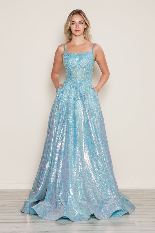 This dress features a straight across neckline with spaghetti straps, a sheer bodice with lace applique and an A-line silhouette with a sequin skirt and pockets. This dress is unique and glamorous and could be perfect for your next prom or formal event.

PY 9554