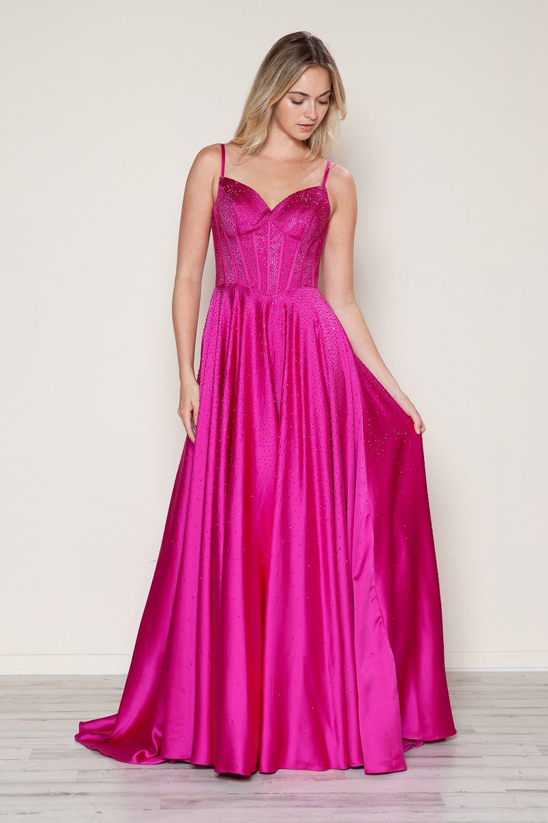 This dress features a bodice with corset boning and spaghetti straps and crystal detailing throughout. The skirt is flowy creating an A-line silhouette with pockets. This dress is timeless and could be ideal for your next prom or formal event!

PY 9610