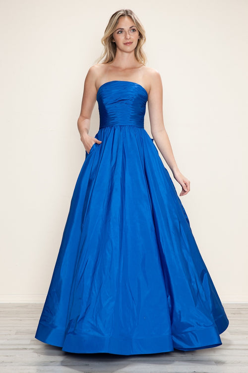 This dress features a strapless neckline with a ruched bodice, a lace-up back with a bow. The taffeta fabric pairs well with the A-line silhouette and pockets for convenience. Style this dress to make it your own at your next prom or formal event.

PY 9754