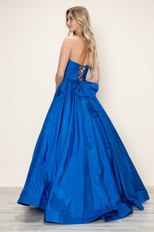 This dress features a strapless neckline with a ruched bodice, a lace-up back with a bow. The taffeta fabric pairs well with the A-line silhouette and pockets for convenience. Style this dress to make it your own at your next prom or formal event.

PY 9754