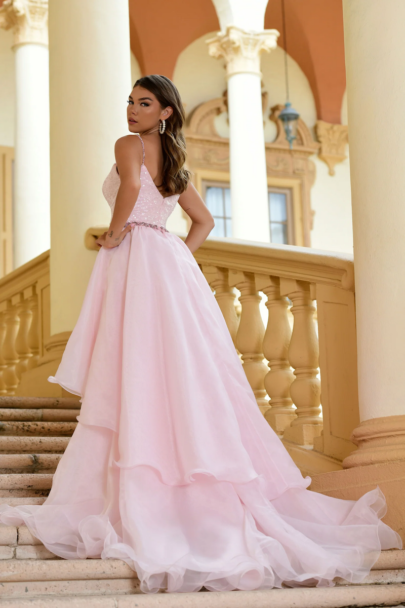 This gown features a sequin fabric with a removable organza tiered skirt with a bejeweled belt. This dress is a statement and could be ideal for your next pageant, prom or formal event.  ARY 28560