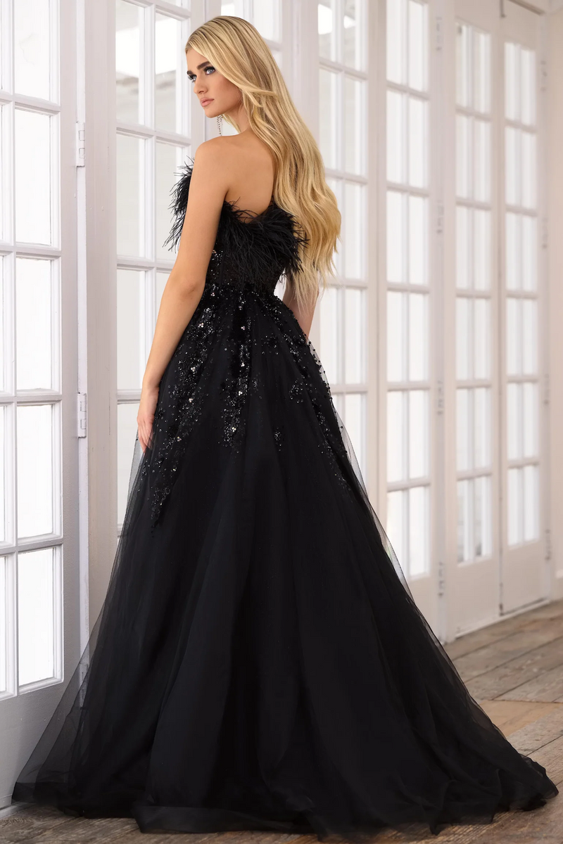 This strapless gown features a sheer corset bodice with feather trim detail on the neckline. The bodice and skirt are adorned with sequins and beads and the A-line skirt features a slit. This dress is unique and high-fashion and could be a perfect choice for your next prom, pageant, or formal event.&nbsp;  ARY 39232