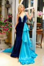 This velvet gown features a beaded neckline and a fitted silhouette with a side ruffle train. The plunge neckline has colored jewels following through the spaghetti straps. A gorgeous choice for your next pageant or formal event.  ARY 39556