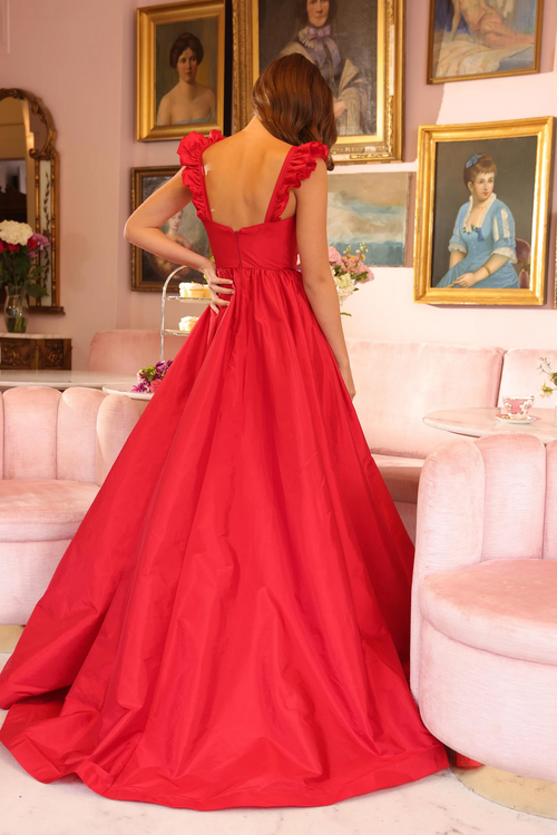 This gown features a sweetheart neckline with ruffled shoulder straps, adding a playful touch to the classic design. The fitted bodice flows into a gathered skirt and a high slit in the front allows for ease of movement. Style this dress to make it your own at your next prom or formal event!

ARY 40094