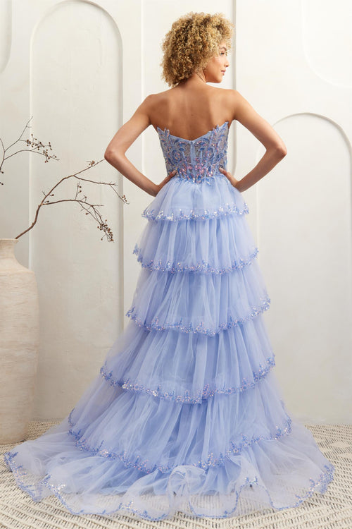 This gown features a strapless ball gown silhouette, illusion corset bodice, lace embroidery, sequin applique, and a tiered tulle skirt. Pair this dress with some simple heels for a unique prom look.&nbsp;

ACE 4033