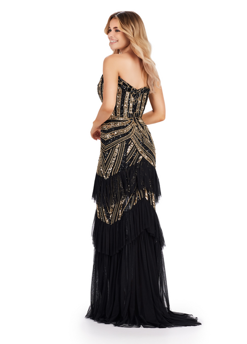 This dress features a strapless plunging v-neckline with a sequin and beaded bodice in an intricate design. This gown also has tulle layer ruffles down the&nbsp;skirt with a front slit. This is a unique and unforgettable dress for prom, pageant, or any formal event.  Ashley Lauren 11438