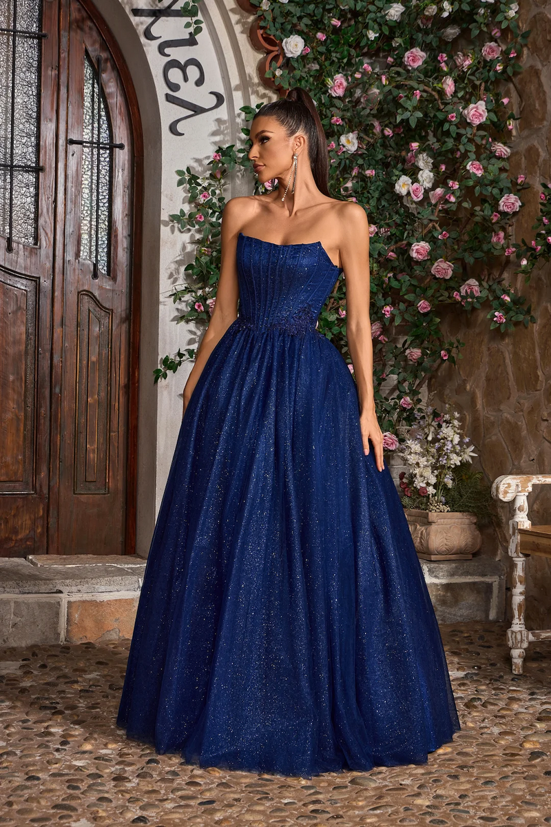 This gown features a strapless neckline with a lace-up back, a bodice with corset boning and a glitter tulle skirt A-line skirt. This fairytale dress may be ideal for your next prom or formal event.&nbsp;

JAD J26008