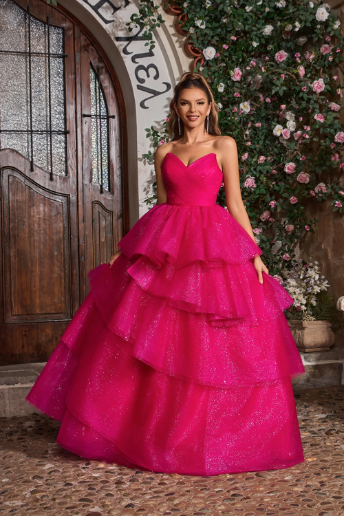 This ballgown features a strapless V-neckline with a lace-up back and an A-line silhouette with glitter tulle layered fabric. This dress is voluminous and playful and may be perfect for your next prom or formal event.

JAD J26021