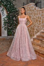 This gown features a square neckline with 1-inch straps, an A-line silhouette with a leaf and floral embroidered design. This dress is whimsical and can be styled to make it your own at your next prom or formal event.

JAD J26018