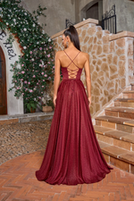 This dress features a boat neckline, spaghetti straps with an open lace-up back. The A-line silhouette with a slit allows for beautiful movement, perfect for your next prom or formal event.&nbsp;

JAD J26014