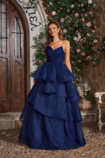 This ballgown features a strapless V-neckline with a lace-up back and an A-line silhouette with glitter tulle layered fabric. This dress is voluminous and playful and may be perfect for your next prom or formal event.

JAD J26021