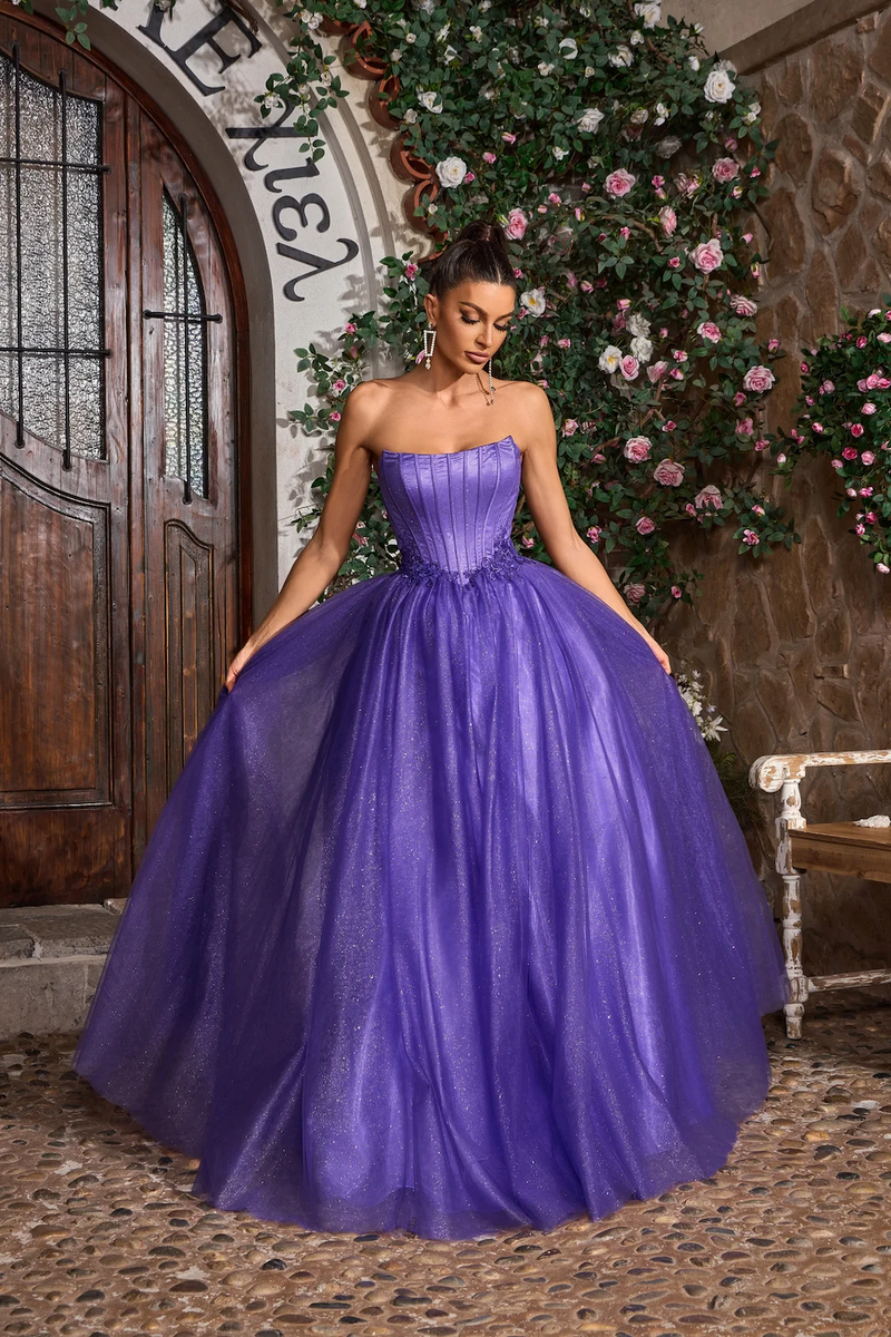 This gown features a strapless neckline with a lace-up back, a bodice with corset boning and a glitter tulle skirt A-line skirt. This fairytale dress may be ideal for your next prom or formal event.&nbsp;

JAD J26008