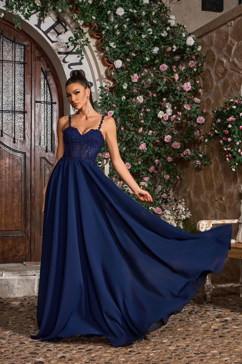 This dress features a sweetheart neckline with spaghetti straps and a lace-up back. The bodice is embellished with lace applique and corset boning with an A-line silhouette. This dress may be perfect for your next prom or formal event.

JAD J26026