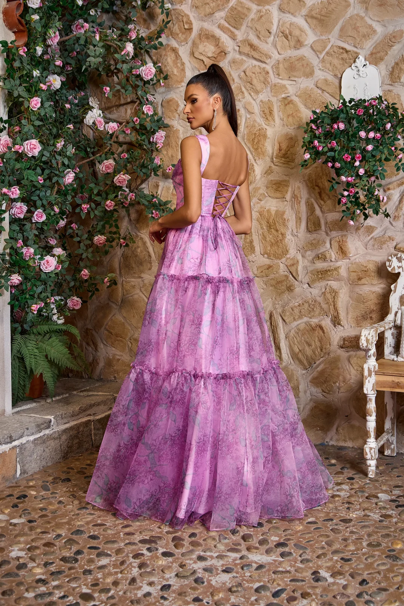 This gown features a square neckline with 1-inch straps and a lace-up back. The A-line silhouette is complimented with a subtle floral print. This dress is unique and could be ideal for your next prom or formal event.

JAD J26041