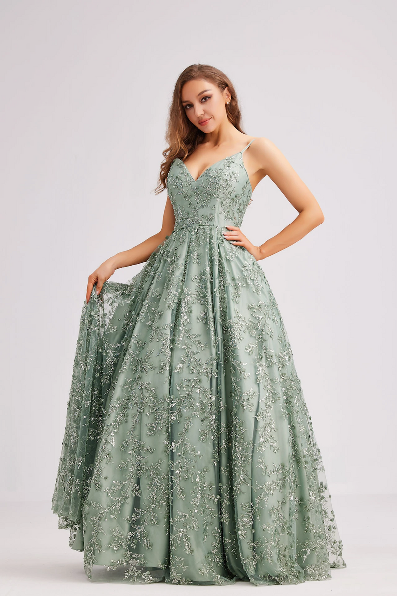 This dress features a V-neckline with spaghetti straps and a lace-up back. The silhouette is A-line with beaded embellished fabric creating an intricate design. This dress is romantic and could be ideal for your next prom or formal event.

JAD J23035