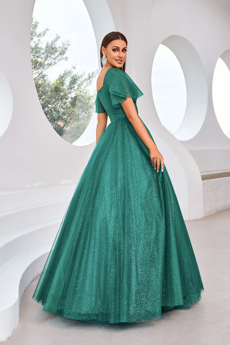 This modest dress features a square neckline with butterfly sleeves, an A-line silhouette with a covered back, and glitter tulle fabric. This dress may be perfect for your next prom or formal event.

JAD J25002