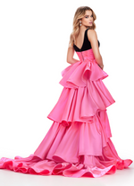 This stunning velvet gown features an illusion v-neckline gown, a tiered ruffled heavy satin overskirt and belt. The fitted silhouette with the flowy overskirt creates a unique shape and dimension and could be perfect for your next pageant, prom or formal event.  Ashley Lauren 11643